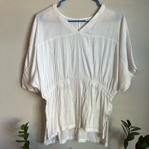 White tunic-Prologue. Flows yet sinches in at the waist.